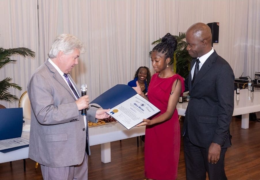 Senator Michael Brady presents an Official Citation.