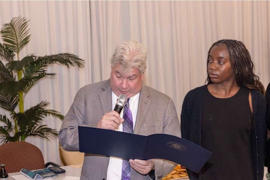 Senator Michael Brady reads an Official Citation.
