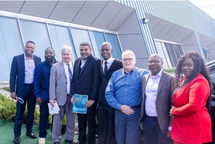 Senator Michael Brady with Charles Awodu and guests outside the venue.
