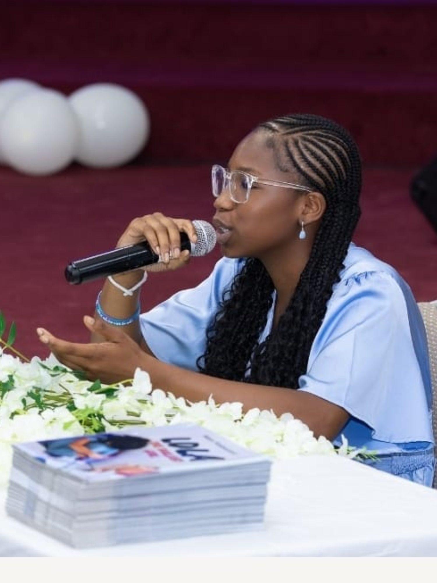 A young WLIF author speaking at an event